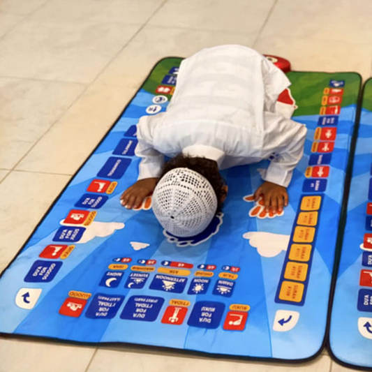 Person praying on a colorful prayer mat with symbols