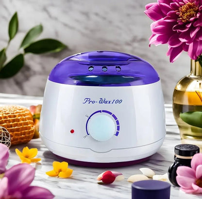 White and purple wax warmer with floral and decorative items on a table